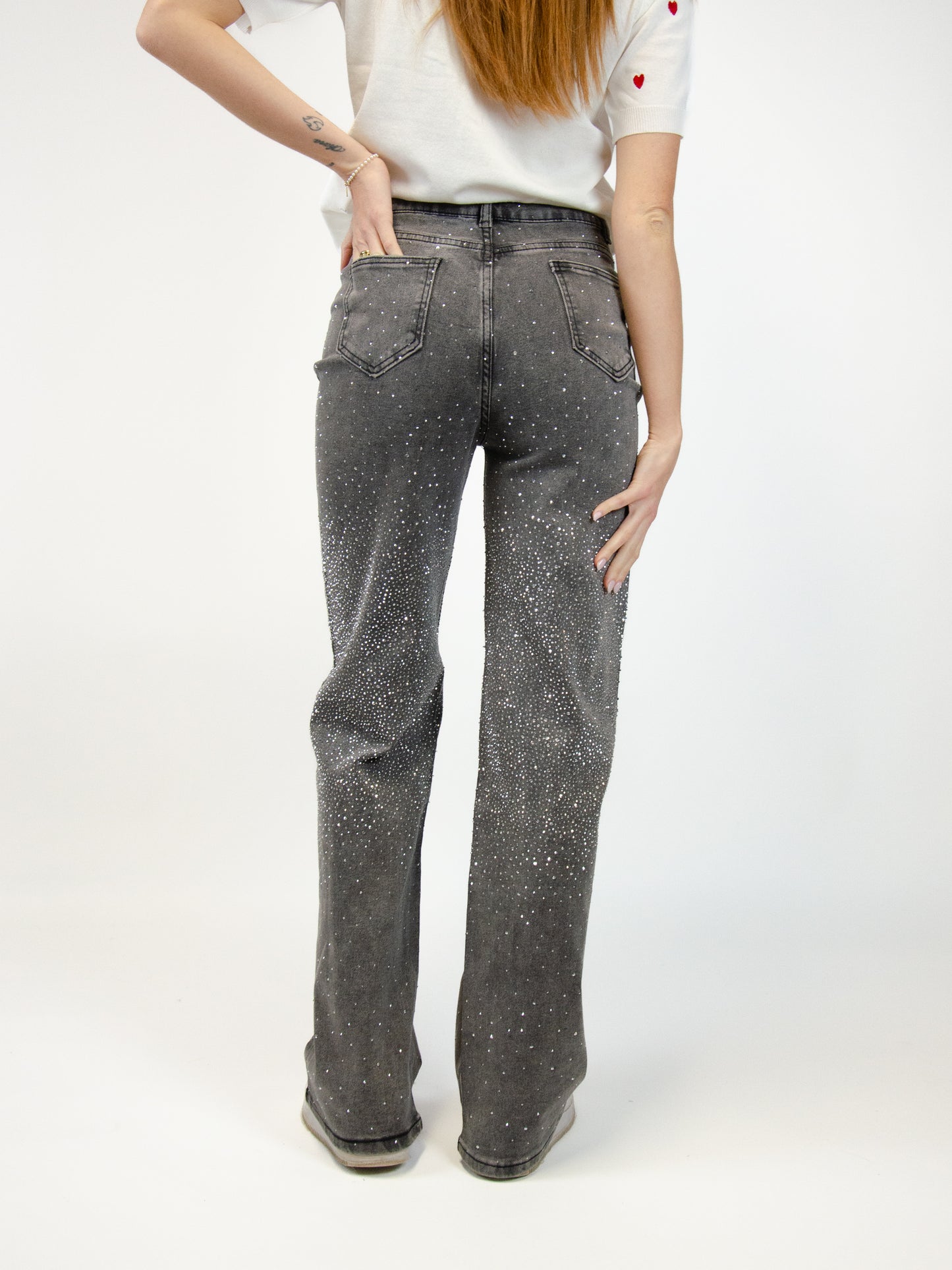 Jeans delavato con strass